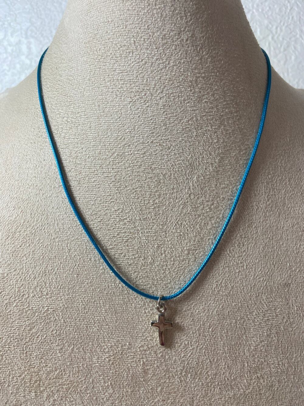 Silver Tone Cross Pendant Necklace on Blue Cord
